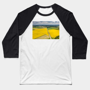 Agricultural landscape, fields of yellow colza and green grain under moody cloudy Baseball T-Shirt